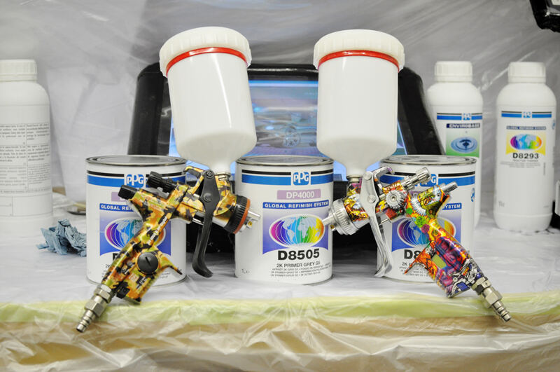 Spray guns hanging in the paint room